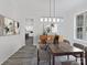 Inviting dining room featuring a modern chandelier, stylish furniture, and decor for elegant meals at 1409 Bloomsberry Ln, Waxhaw, NC 28173