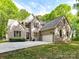 Beautiful two-story brick home with well-manicured lawn and attached two car garage at 1409 Bloomsberry Ln, Waxhaw, NC 28173