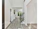 Bright foyer with gray wood-look flooring leads to a spacious living area at 1409 Bloomsberry Ln, Waxhaw, NC 28173