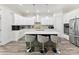 Modern kitchen with stainless steel appliances, a large island, and sleek countertops at 1409 Bloomsberry Ln, Waxhaw, NC 28173