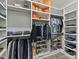 Organized walk-in closet with ample storage space for clothing and shoes at 1409 Bloomsberry Ln, Waxhaw, NC 28173
