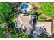 Expansive aerial view of the home showcasing the spacious lot, pool, and surrounding mature trees at 14131 Lea Point Ct, Huntersville, NC 28078