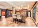 Finished basement boasts a stylish bar with stone accent column, tile floors, and a convenient beverage center at 14131 Lea Point Ct, Huntersville, NC 28078