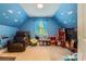 Fun bonus room with blue walls, cloud decals, and a blue sky theme at 14131 Lea Point Ct, Huntersville, NC 28078