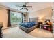 Nicely decorated bedroom with a ceiling fan, large window, and a comfy bed at 14131 Lea Point Ct, Huntersville, NC 28078