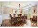 Formal dining room featuring dark wood table, ornate chairs, and chandelier at 14131 Lea Point Ct, Huntersville, NC 28078
