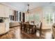Dining area featuring a long, wood table and hardwood floors at 14131 Lea Point Ct, Huntersville, NC 28078