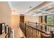 Hallway with decorative railing overlooking dining area at 14131 Lea Point Ct, Huntersville, NC 28078