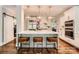 Elegant kitchen with white cabinets, large island, modern lighting, and stainless steel appliances at 14131 Lea Point Ct, Huntersville, NC 28078