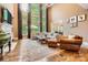 Bright living room with hardwood floors, large windows, fireplace and ample seating at 14131 Lea Point Ct, Huntersville, NC 28078