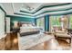 Main bedroom features tray ceilings, hardwood floors, and natural light at 14131 Lea Point Ct, Huntersville, NC 28078