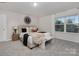 Inviting bedroom boasts soft carpet, neutral walls, window, and modern decor at 1419 5Th Street Ne Dr, Hickory, NC 28601