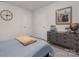 Cozy bedroom with carpet, natural light, guitar art and dark dresser at 1419 5Th Street Ne Dr, Hickory, NC 28601