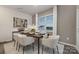 Inviting dining room features a modern table set for six, complemented by stylish decor and ample natural light at 1419 5Th Street Ne Dr, Hickory, NC 28601