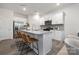 Modern kitchen boasts white cabinets, stainless steel appliances, granite countertops, and a center island with bar stools at 1419 5Th Street Ne Dr, Hickory, NC 28601