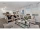 Spacious living room with hardwood floors, large windows, and open concept kitchen at 1419 5Th Street Ne Dr, Hickory, NC 28601