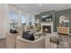 Cozy living room features a fireplace, large windows, and stylish furniture at 1419 5Th Street Ne Dr, Hickory, NC 28601