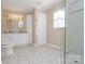 Clean bathroom featuring double sinks, tiled floor, and a glass-enclosed shower at 1537 Haupt Strasse None, Conover, NC 28613