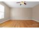 Empty bedroom with hardwood floors, ceiling fan, and bright window light at 1537 Haupt Strasse None, Conover, NC 28613