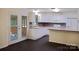 Well-lit kitchen showcasing white cabinetry, tiled backsplash, and an efficient layout at 1537 Haupt Strasse None, Conover, NC 28613