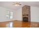 Bright and airy living room featuring a stone fireplace and hardwood floors, perfect for entertaining at 1537 Haupt Strasse None, Conover, NC 28613