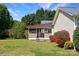 Cozy screened-in porch off the back of the house, surrounded by green lawn and landscaping at 1537 Haupt Strasse None, Conover, NC 28613