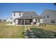 View of backyard featuring a gazebo and an outdoor kitchen, perfect for entertaining and outdoor living at 1543 Ab Moore Jr Dr, Indian Trail, NC 28079