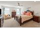Spacious bedroom featuring a dark wood bed frame, matching dresser, and a bright window letting in natural light at 1543 Ab Moore Jr Dr, Indian Trail, NC 28079