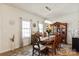 Bright dining room featuring a large wooden table, decorative hutch, and ample natural light at 1543 Ab Moore Jr Dr, Indian Trail, NC 28079