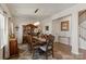 Elegant dining room with a large wooden table, decorative china cabinet, and stylish accents for entertaining at 1543 Ab Moore Jr Dr, Indian Trail, NC 28079
