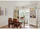 Cozy dining area featuring a wooden table set, ample natural light, and stylish decor for Gathering meals at 1543 Ab Moore Jr Dr, Indian Trail, NC 28079