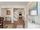 Bright foyer with hardwood floors, stylish decor, and views into the living spaces create a welcoming entrance at 1543 Ab Moore Jr Dr, Indian Trail, NC 28079