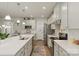 Modern kitchen with a large central island, stainless steel appliances, and sleek countertops for meal prep at 1543 Ab Moore Jr Dr, Indian Trail, NC 28079
