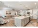 Open-concept kitchen features a large island connecting to the living room, creating an inviting space at 1543 Ab Moore Jr Dr, Indian Trail, NC 28079