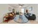 Cozy living room featuring neutral walls, plush furniture, a round rug, and ample natural light at 1543 Ab Moore Jr Dr, Indian Trail, NC 28079