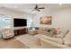 Comfortable living room boasts a plush sectional sofa, a large TV, and ample natural light at 1543 Ab Moore Jr Dr, Indian Trail, NC 28079