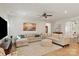 Spacious living room features a large sectional sofa, stylish decor, and plenty of room for entertaining at 1543 Ab Moore Jr Dr, Indian Trail, NC 28079