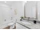 Bathroom with white vanity, granite countertop, and bathtub with shower at 1615 Martin Ave, Gastonia, NC 28052