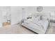 Comfortable bedroom featuring carpeted floor, a large window, a ceiling fan, and minimalist decor at 1615 Martin Ave, Gastonia, NC 28052