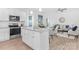 Bright, open kitchen featuring stainless steel appliances and a central island with granite countertop at 1615 Martin Ave, Gastonia, NC 28052