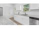 Well-lit kitchen with white cabinets, granite countertops, and stainless steel appliances at 1615 Martin Ave, Gastonia, NC 28052