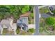 Aerial view of home showcasing roof, multi-car driveway, manicured landscaping, and neighborhood street at 16532 Flintrock Falls Ln, Charlotte, NC 28278