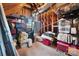 Unfinished attic space with visible framing and storage items, offering potential for customization at 16532 Flintrock Falls Ln, Charlotte, NC 28278
