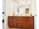 This spacious bathroom boasts a double vanity with lots of cabinet space and large mirror at 16532 Flintrock Falls Ln, Charlotte, NC 28278