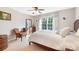 Comfortable bedroom with carpeted floor and a large window featuring floral curtains at 16532 Flintrock Falls Ln, Charlotte, NC 28278