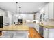 Bright, modern kitchen featuring white cabinetry, granite countertops, and stainless steel appliances at 16532 Flintrock Falls Ln, Charlotte, NC 28278