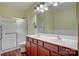 The bathroom has double sinks with a shower-tub combination at 16746 Amberside E Rd, Cornelius, NC 28031