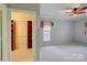 Spacious carpeted bedroom with ceiling fan and natural light from window at 16746 Amberside E Rd, Cornelius, NC 28031