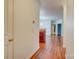 Welcoming hallway featuring wood floors and a view into other living spaces at 16746 Amberside E Rd, Cornelius, NC 28031