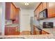 Modern kitchen featuring stainless steel appliances, granite counters, and tile backsplash at 16746 Amberside E Rd, Cornelius, NC 28031